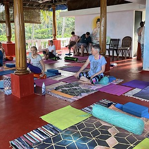Students on yoga mats whilst Jyoti taught in India in 2023